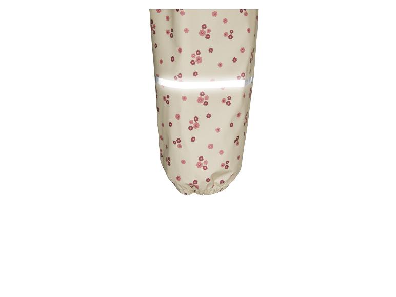 Regenbroek met bloemenprint en reflecterende details.