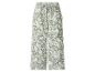 Groene en witte broek met wijde pijpen, bloemenprint en strikceintuur.