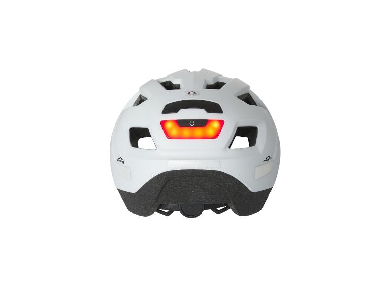 Witte fietshelm met geïntegreerd rood achterlicht en Crivit-logo.