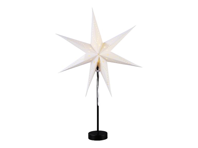 Witte papieren ster met lichtjes op een zwarte standaard.