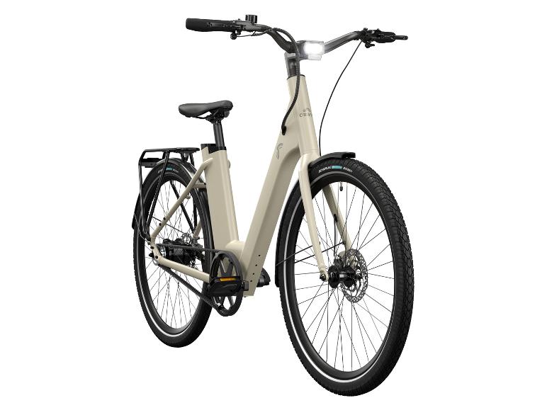 Een beige elektrische fiets met Schwalbe banden.