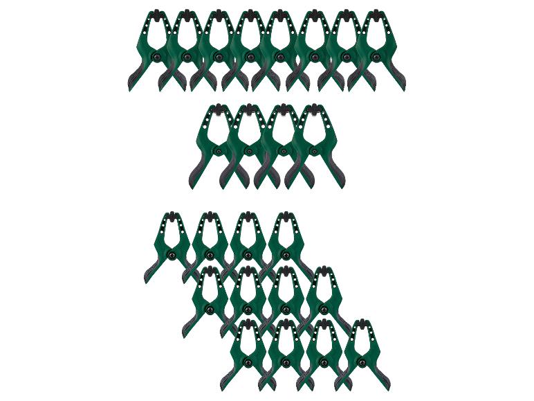 Groene veerklemmen gerangschikt in rijen op een witte achtergrond.