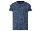 Een blauwe T-shirt met korte mouwen van Live-Energy met een tropisch bladerenpatroon.