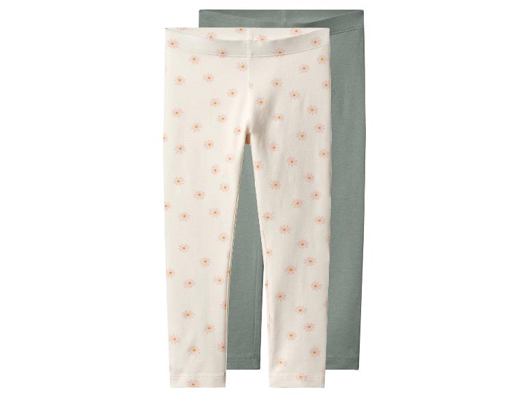 2-pack baby leggings: één gebroken wit met madeliefjes en één effen groen