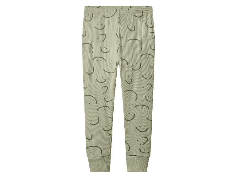 Groene geribbelde legging met lachend gezichtspatroon
