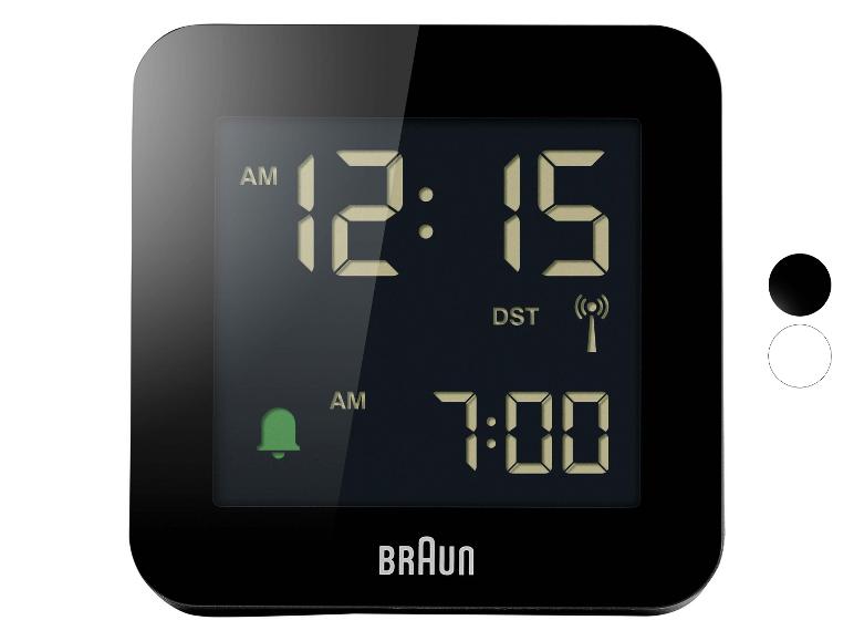 Zwarte digitale wekker met display dat 12:15 AM en alarm ingesteld op 7:00 AM toont.