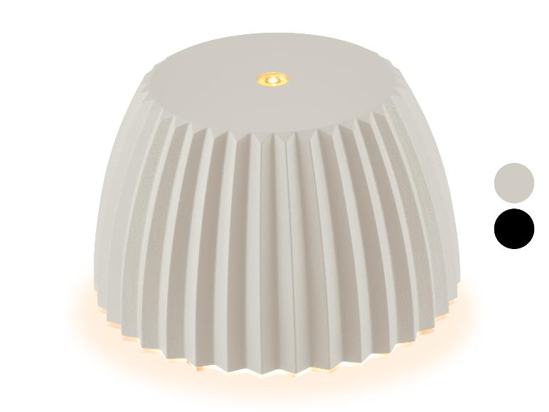 Witte tafellamp met een geplooide kap en twee kleuropties.