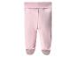 Roze baby leggings met voetjes.