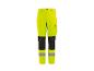 High-visibility werkbroek in neongeel met zwarte kniestukken en reflecterende strepen.