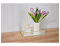 Een glazen dienblad met gouden rand, een diffuser en een vaas met tulpen.