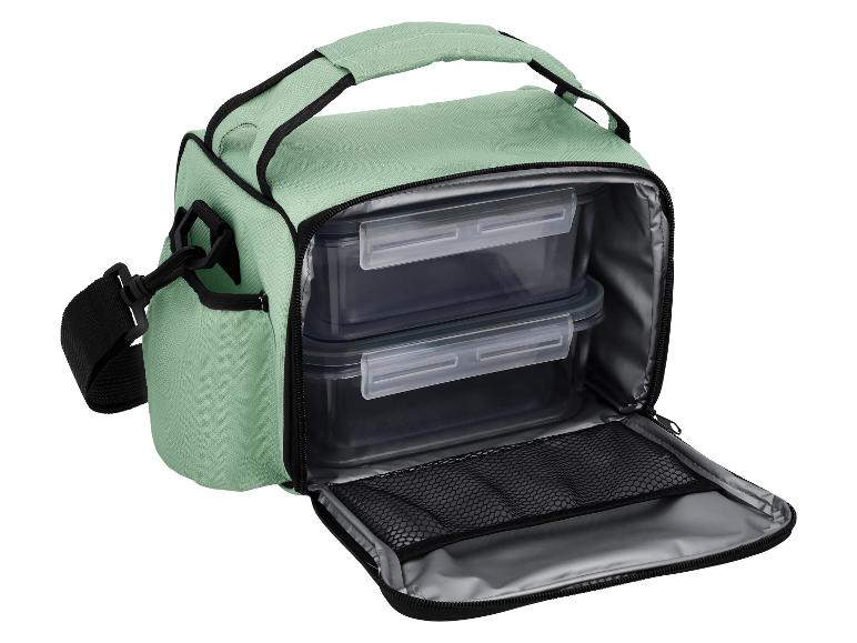 Lichtgroene lunchtas met twee doorzichtige voedselcontainers en een schouderriem