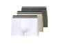Drie paar heren boxershorts in wit, beige en groen.