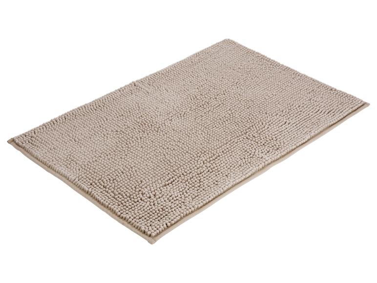 Beige badmat met pluizige textuur