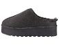 Donkergrijze platformslipper met een gestructureerde zool, zijaanzicht.