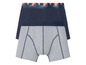 Twee boxershorts, een donkerblauwe en een grijs met palmbomen