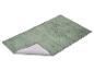 Groene pluizige badmat met antislip onderkant