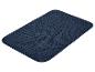 Donkerblauwe deurmat of badmat met afgeronde hoeken.