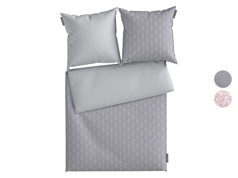 MICHALSKY beddengoed met grijs-wit geometrisch patroon en effen grijs, met twee kussens.