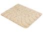 Beige badmat met golvende textuur.