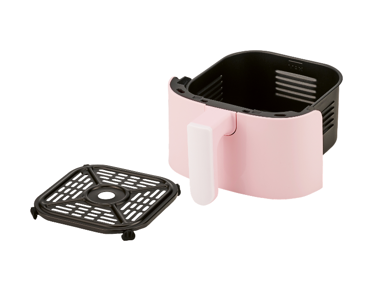 Een roze airfryer met een uitneembaar mandje.
