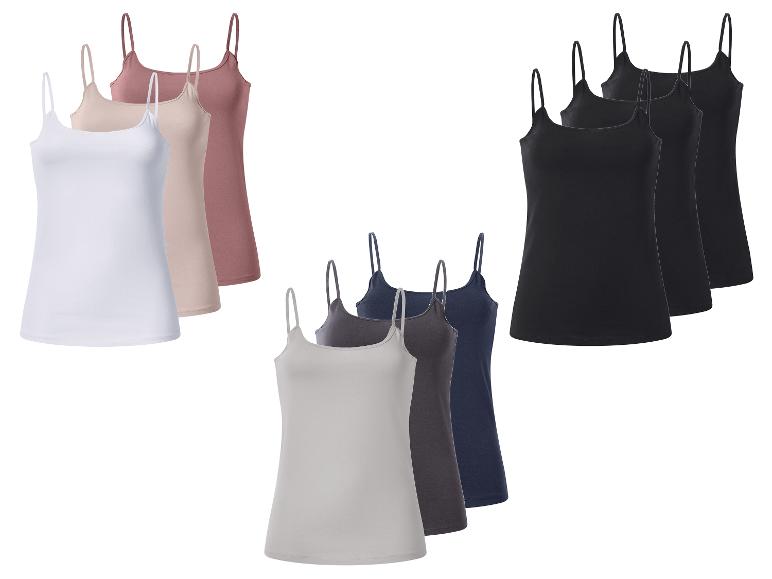 Set van negen dames spaghetti topjes in wit, beige, roze, grijs, donkerblauw en zwart.