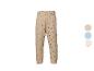 Beige joggingbroek met zwarte stippen, elastische tailleband en manchetten.