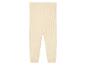 Beige gebreide leggings voor baby's.