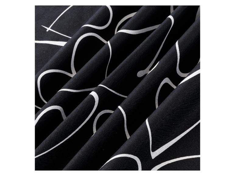 Zwarte stof met een wit abstract patroon.