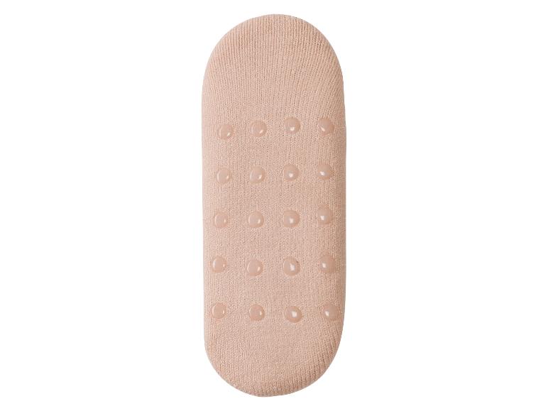Roze sokken met antislip stippen.