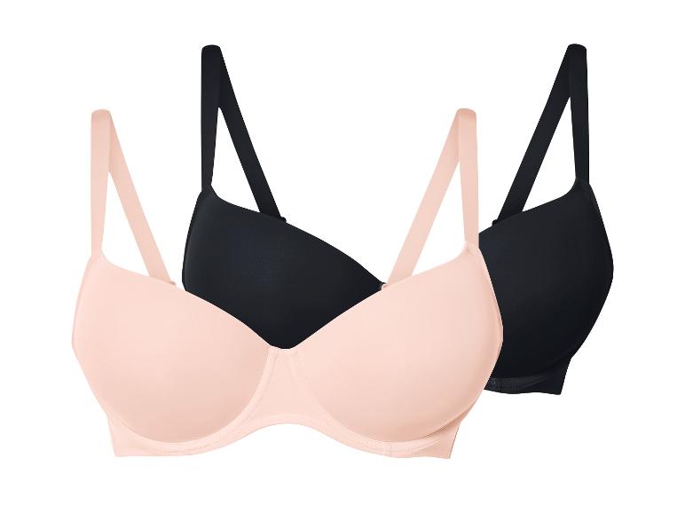 Twee bh's, één lichtroze en één zwart.