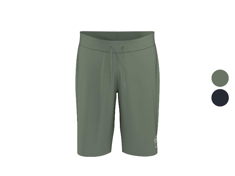 Groene sportshorts met verstelbaar trekkoord en een klein logo.