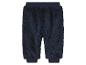 Een donkerblauwe joggingbroek van fleece voor baby's.