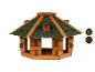 Houten vogelvoederhuisje met groen dak en dak kleurmonsters.