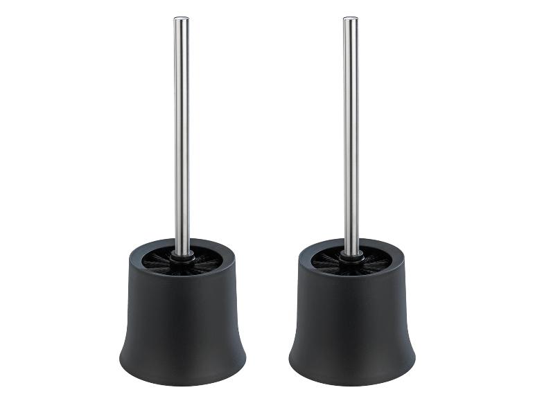 Twee zwarte toiletborstels met metalen handvat.