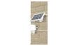 LED-solar schijnwerper met bewegingssensor op een bakstenen muur.