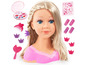 Een blonde pop met make-upset, haaraccessoires en stickers.