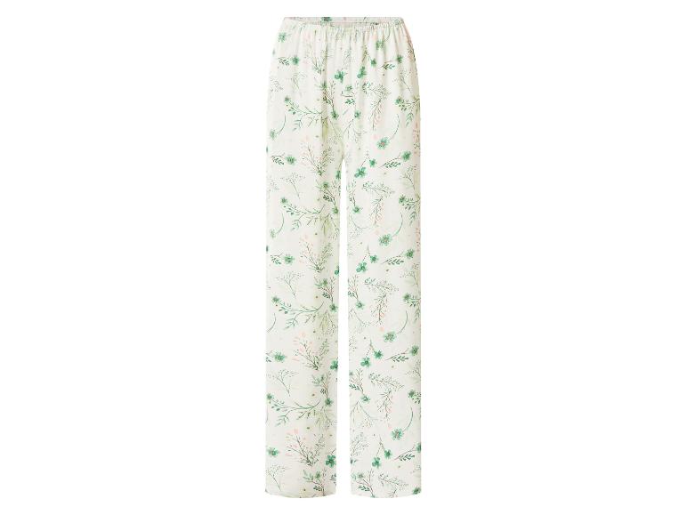 Witte pyjamabroek met een groen bloemenpatroon.