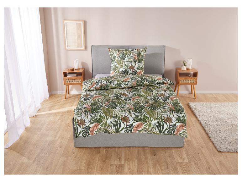 Beddengoedset met tropisch bladmotief.