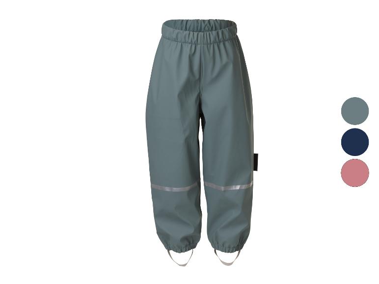 Waterdichte kinderbroek in teal met reflecterende strepen en voetlussen