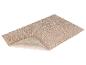 Beige badmat met een zachte textuur.