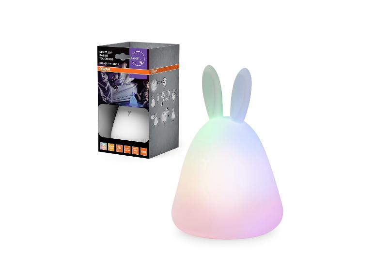 Nachtlampje in de vorm van een konijn met USB-aansluiting en kleurveranderende LED's, naast de verpakking.