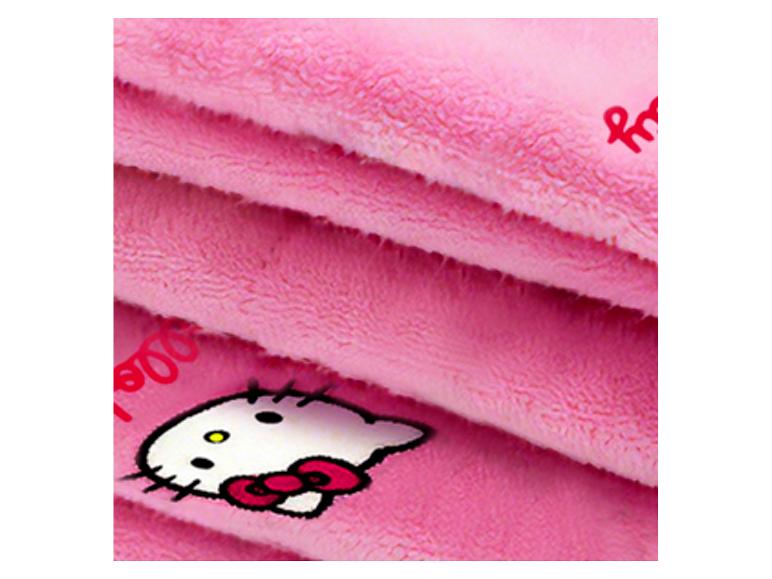 Close-up van de zachte roze stof van de Hello Kitty elektrische deken.