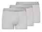 Drie witte boxershorts met een grijze elastische tailleband.