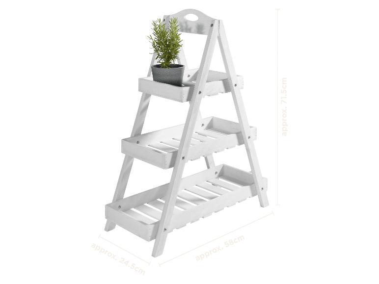 Witte houten plantenstandaard met drie niveaus en een potplant, met afmetingen.