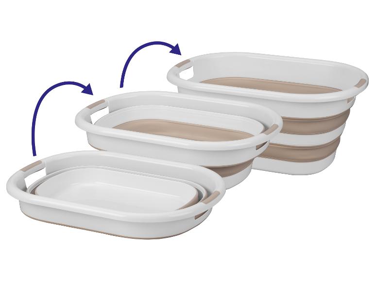 Drie opvouwbare wasmanden op elkaar gestapeld.