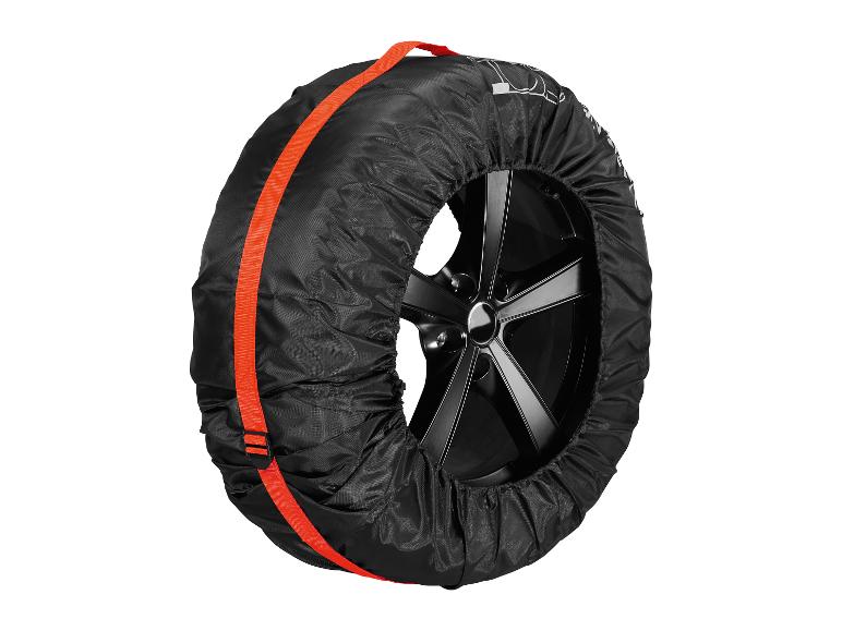 Een zwarte bandenhoes met oranje banden beschermt een band met zwarte velgen.