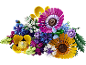 Een kleurrijk boeket speelgoedbloemen, inclusief madeliefjes, rozen en andere bloesems.