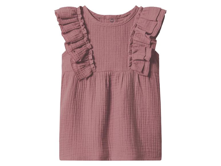 Roze babyjurk met ruchesmouwen en gestructureerde stof