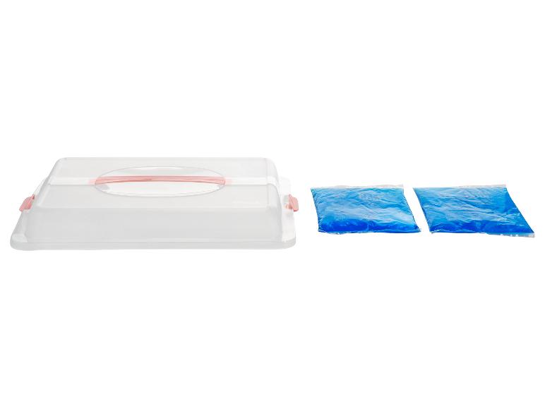 Transparante taartdoos met roze handvat en twee blauwe koelelementen.