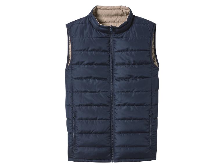 Donkerblauw gewatteerd vest met beige binnenvoering en ritssluiting.